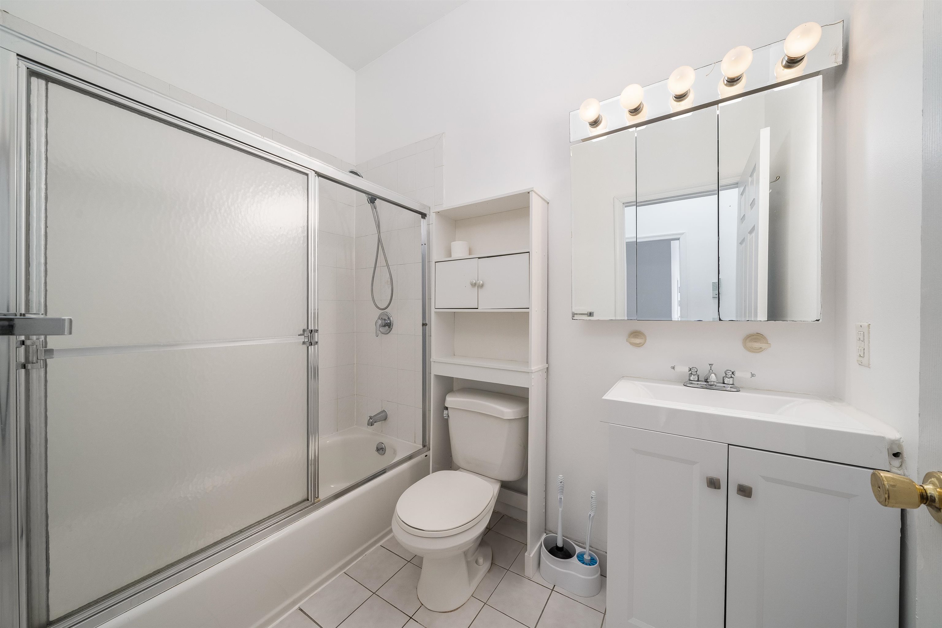 639 Garden Street, Unit 1 Hoboken, NJ 07030 - Photo 11 of 17 a bathroom with a toilet sink and shower