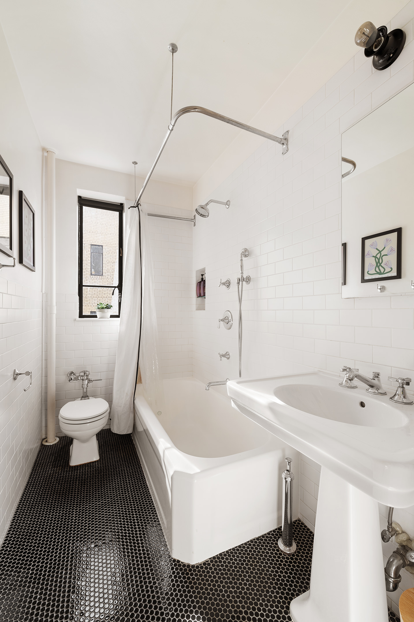 250 West 24th Street, Unit 6/5CE Manhattan, NY 10011 - Photo 7 of 11 a bathroom with a sink a toilet and a bathtub