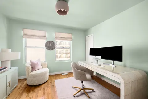 a workspace with furniture and a window