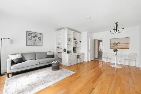 a living room with furniture and white walls