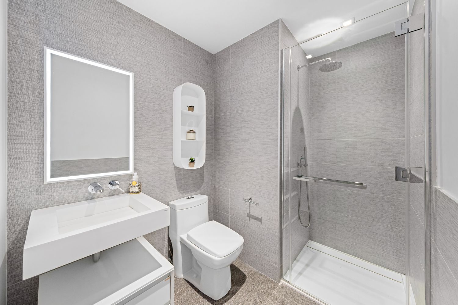 a bathroom with a sink toilet and shower