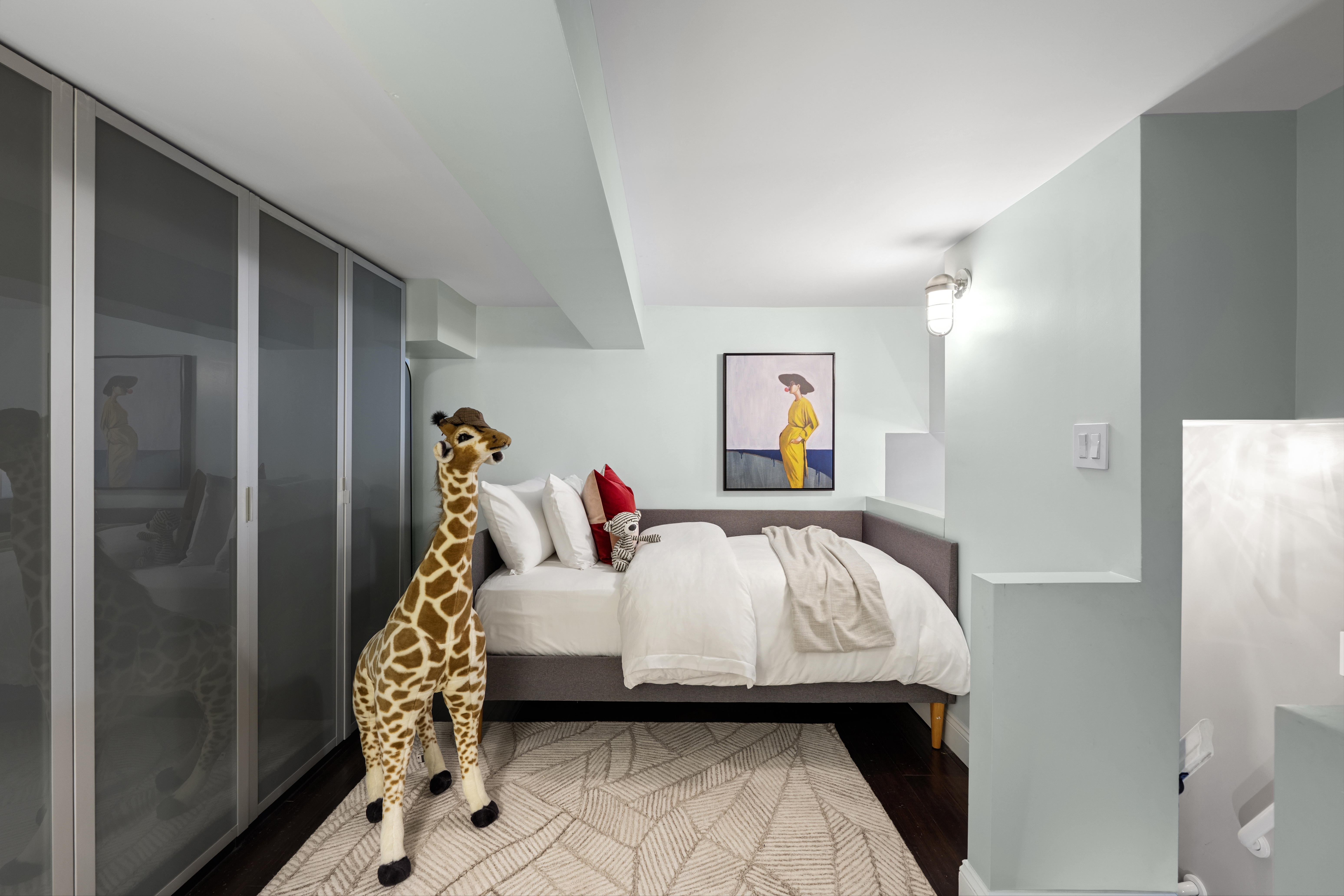 253 West 73rd Street, Unit 6B-C Manhattan, NY 10023 - Photo 12 of 21 a bed sitting in a bedroom next to a window