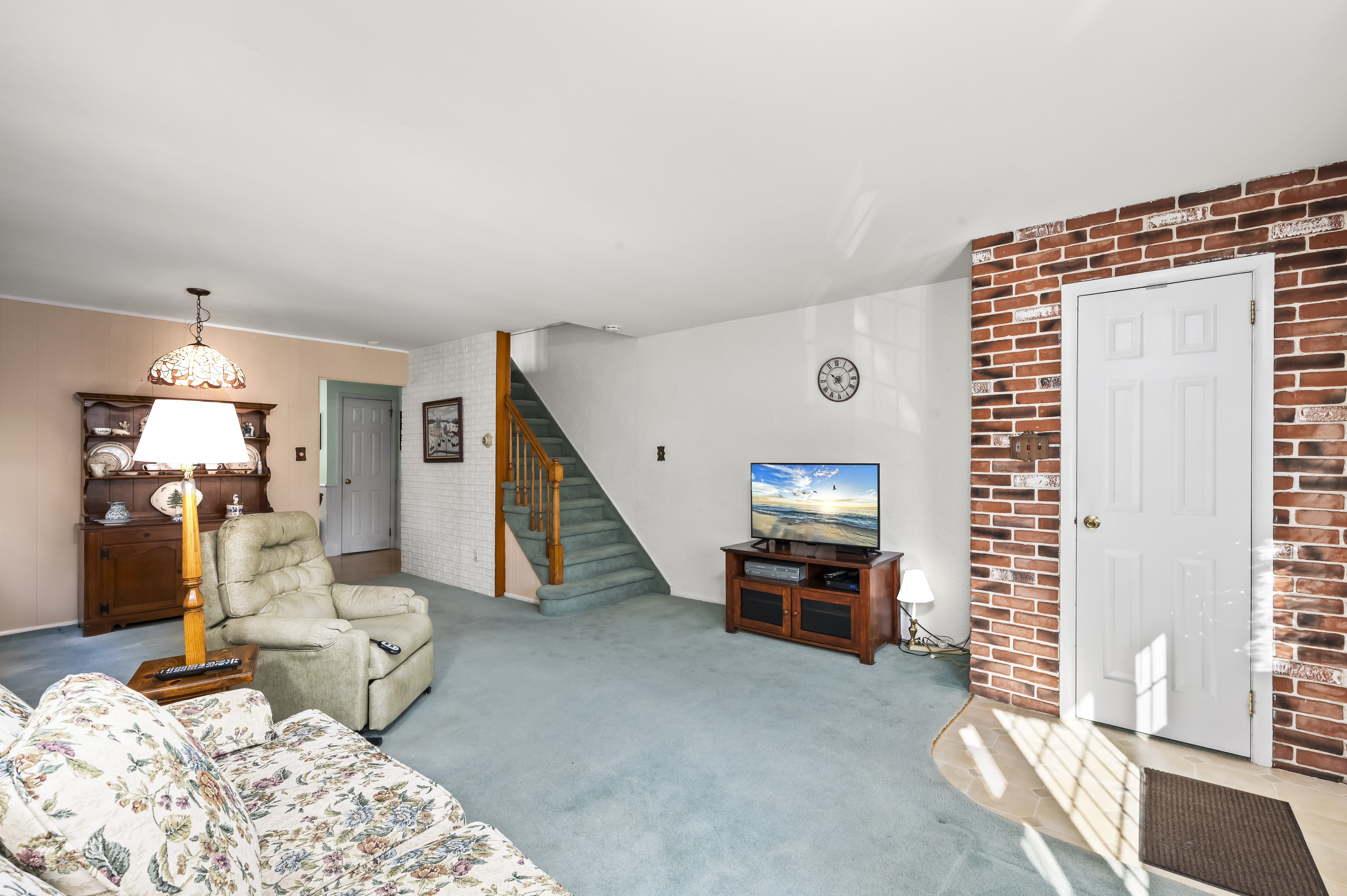 15 Area Place Staten Island, NY 10314 - Photo 5 of 27 a living room with furniture and a flat screen tv