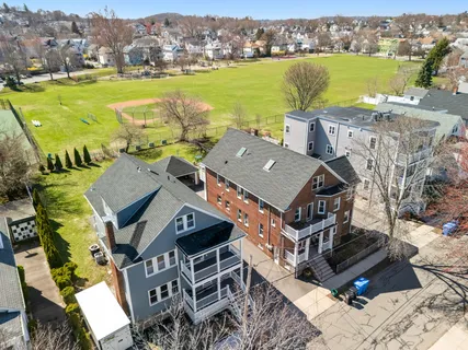 an aerial view of a house with a ocean view