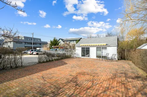 a view of swimming pool with outdoor seating and city view
