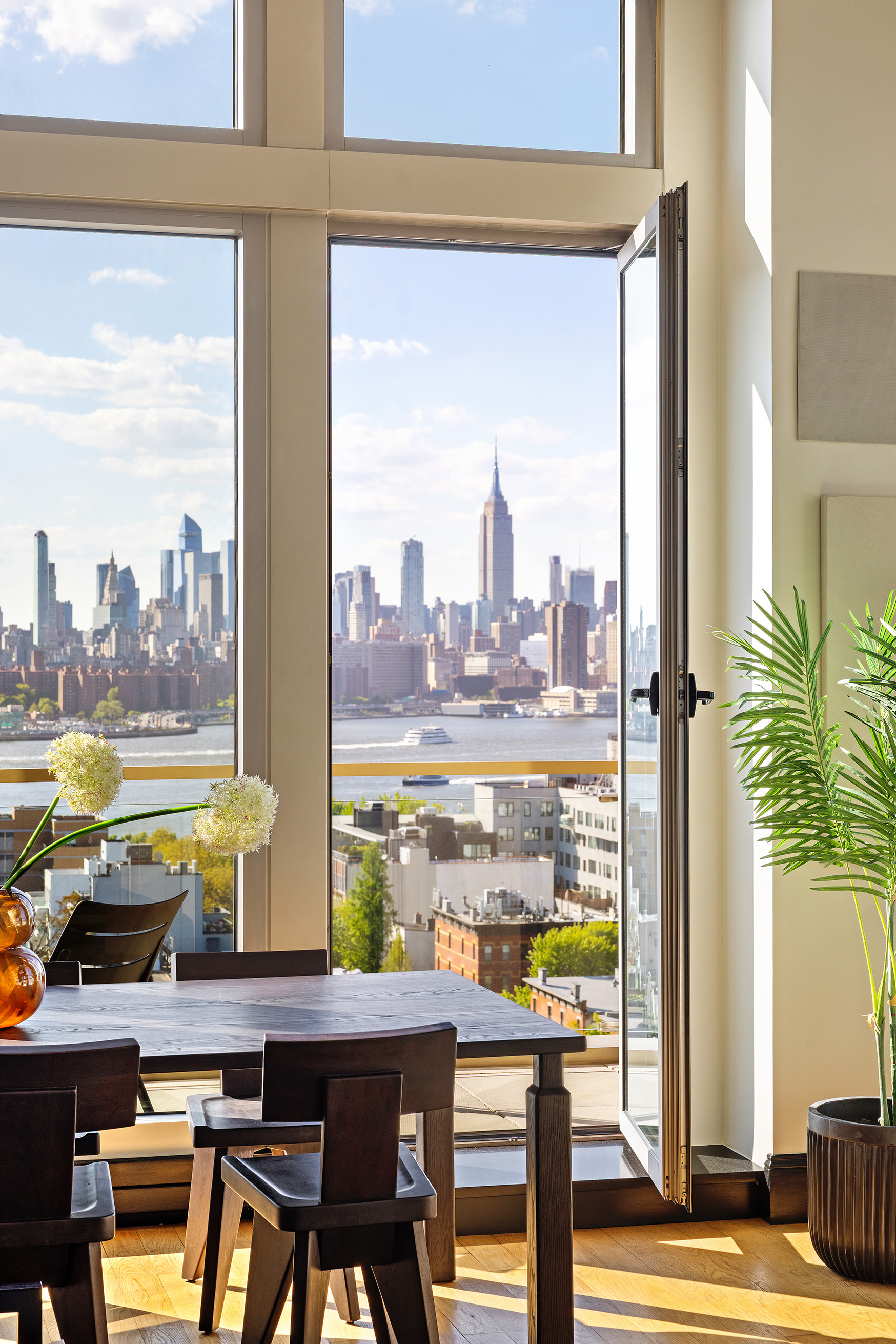 144 North 8th Street, Unit 12A Brooklyn, NY 11249 - Photo 2 of 21 a view of a balcony with chairs and a table