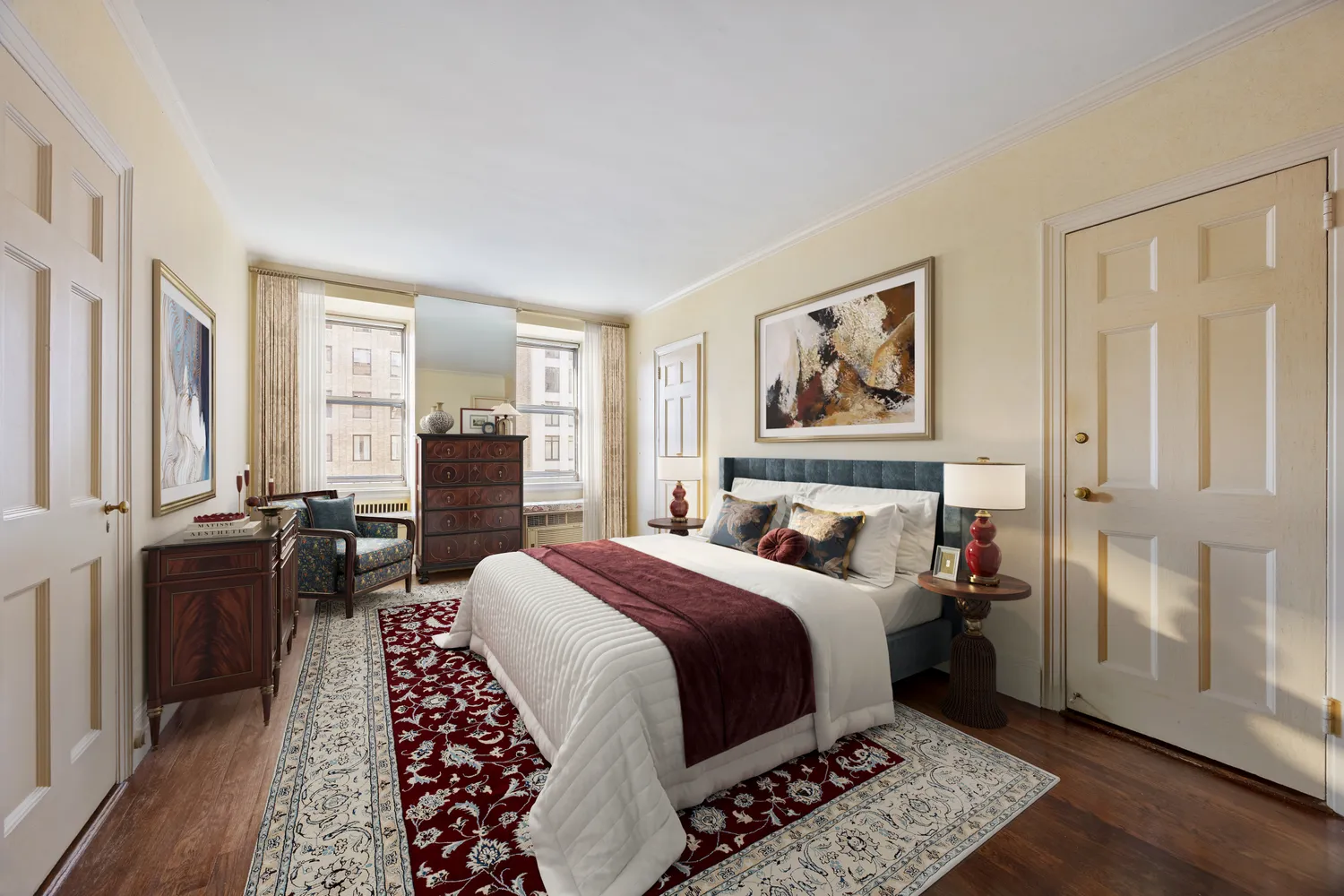 a bedroom with a bed a dresser and wooden floor