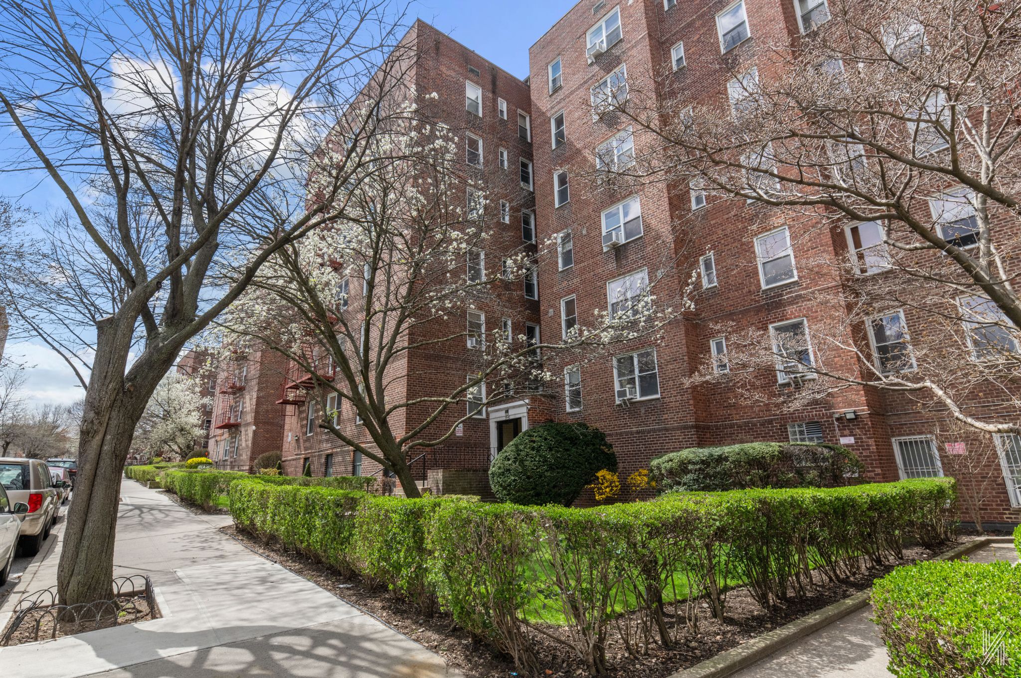 39-30 52nd Street, Unit 5E Queens, NY 11377 - Photo 14 of 15 a view of a building with a garden