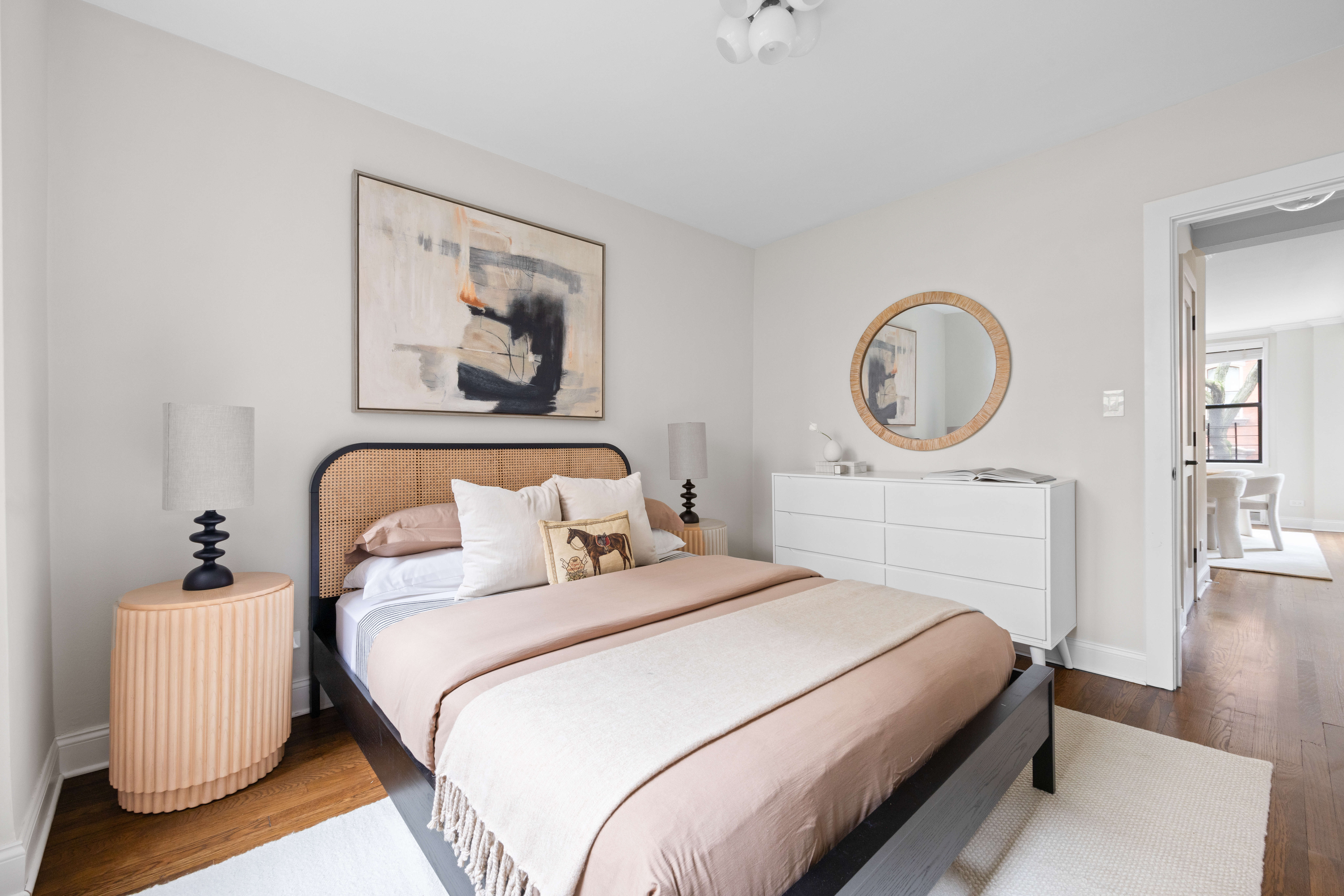 211 East 18th Street, Unit 2O Manhattan, NY 10003 - Photo 10 of 14 a bedroom with bed and a chandelier