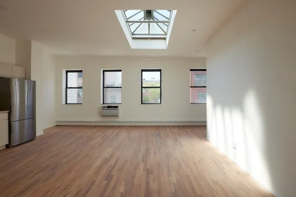 a view of livingroom with hardwood floor and hallway