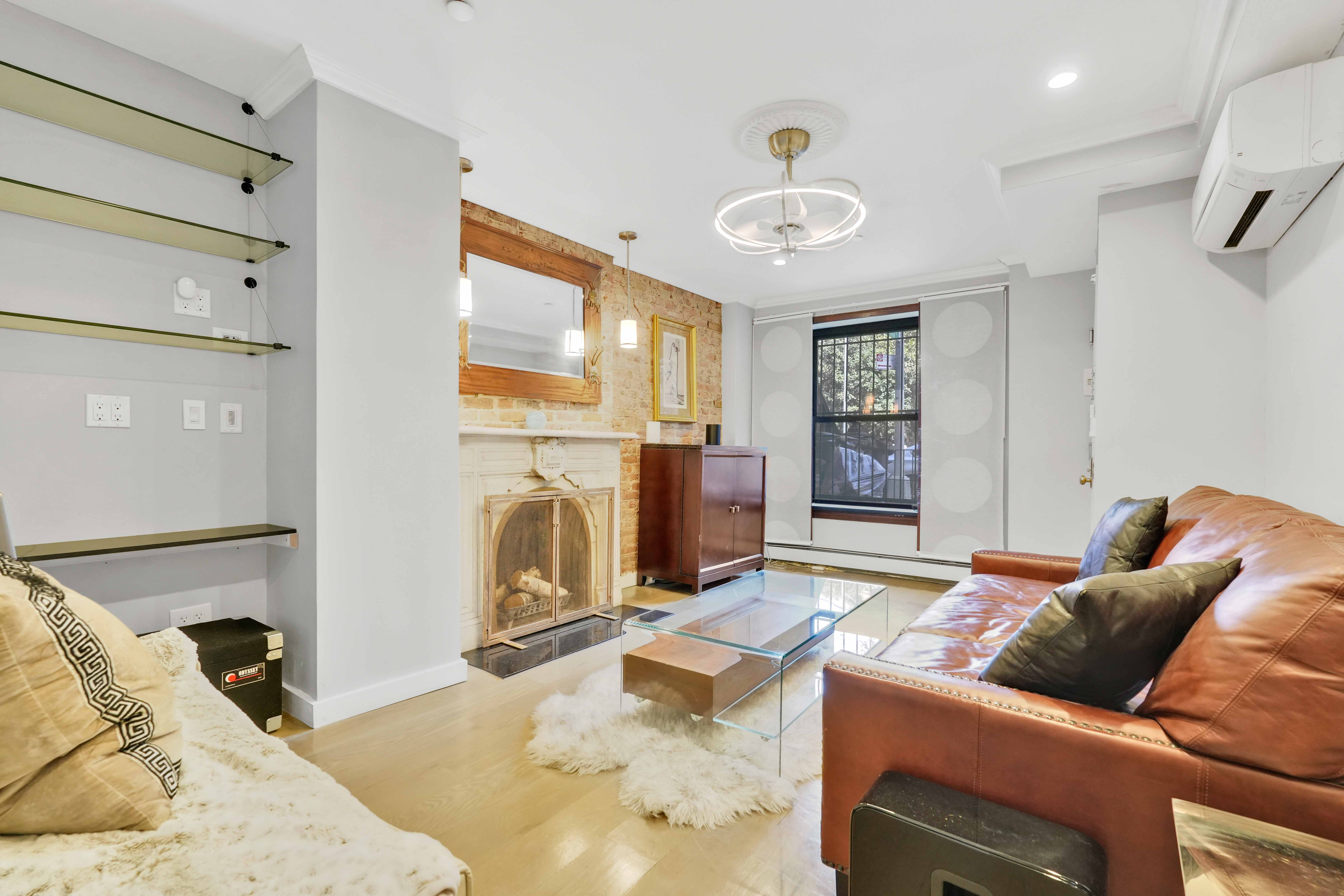 288 St James Place, Unit TRIPLEX Brooklyn, NY 11238 - Photo 4 of 25 a living room with furniture and a flat screen tv