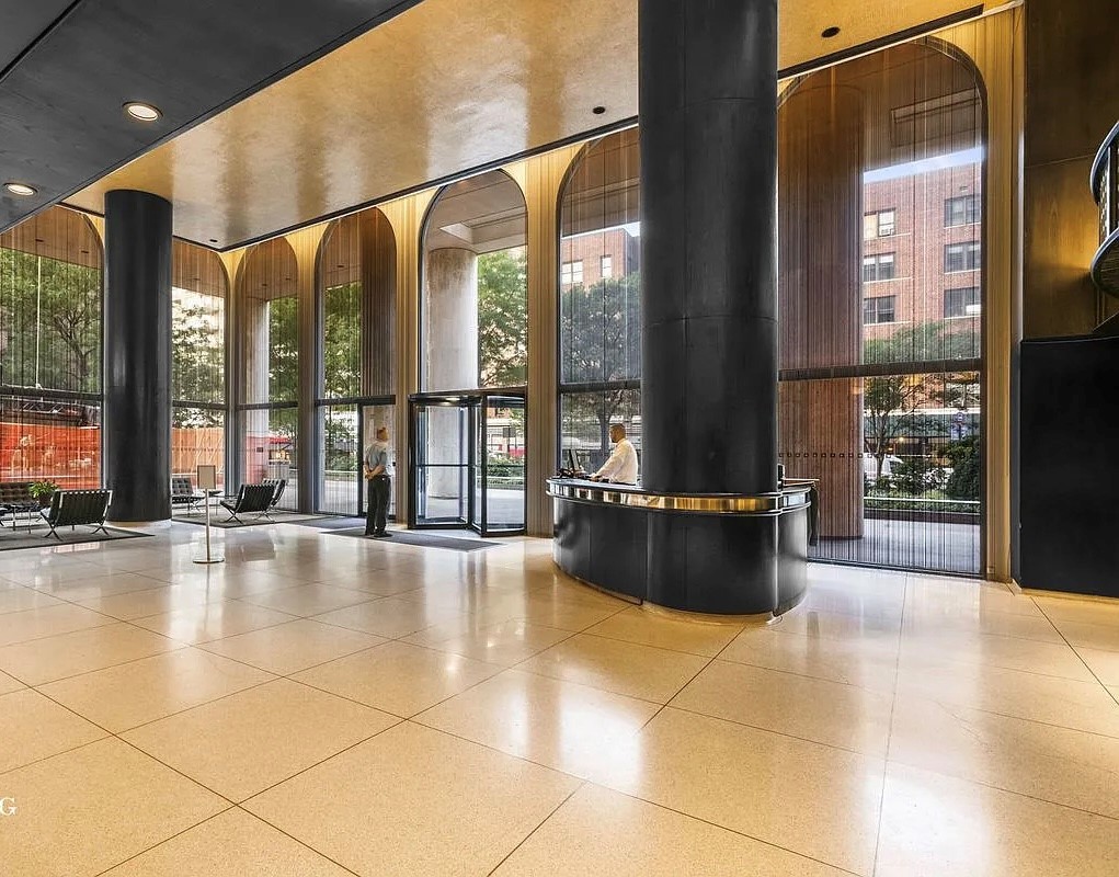 60 East 8th Street, Unit 23D Manhattan, NY 10003 - Photo 15 of 16 a living room with a large window