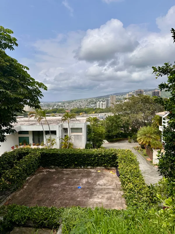 a view of multiple houses with a yard