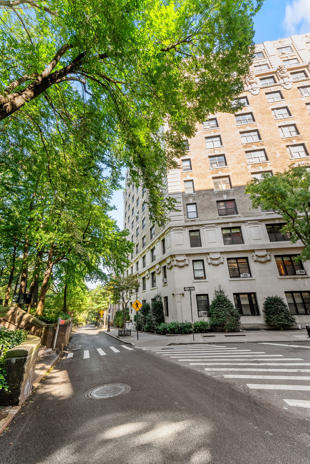 210 Riverside Drive, Unit 2E Manhattan, NY 10025 - Photo 14 of 15 a view of a building with a tree
