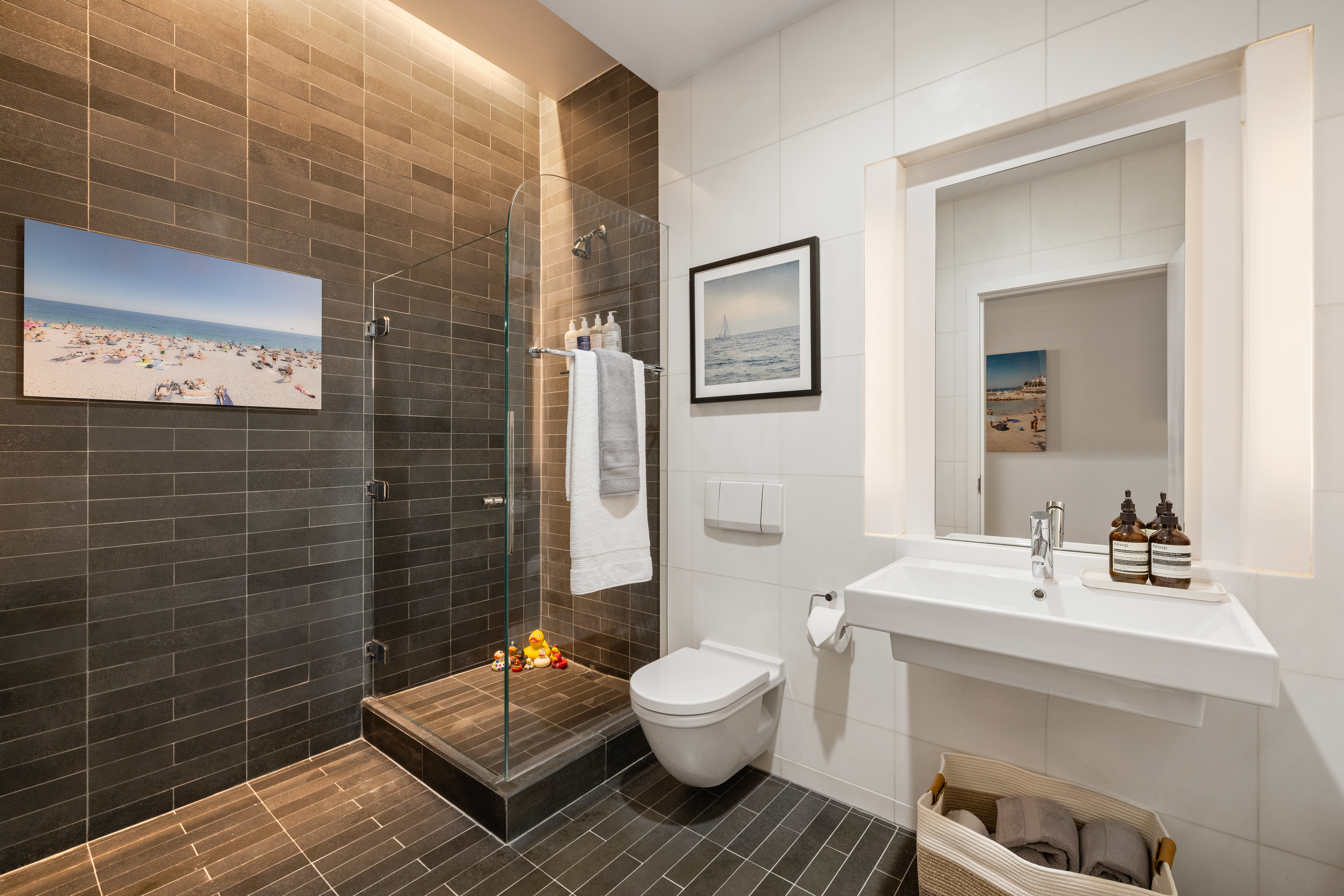 56 East 11th Street, Unit 5 Manhattan, NY 10003 - Photo 10 of 18 a bathroom with a sink toilet and shower