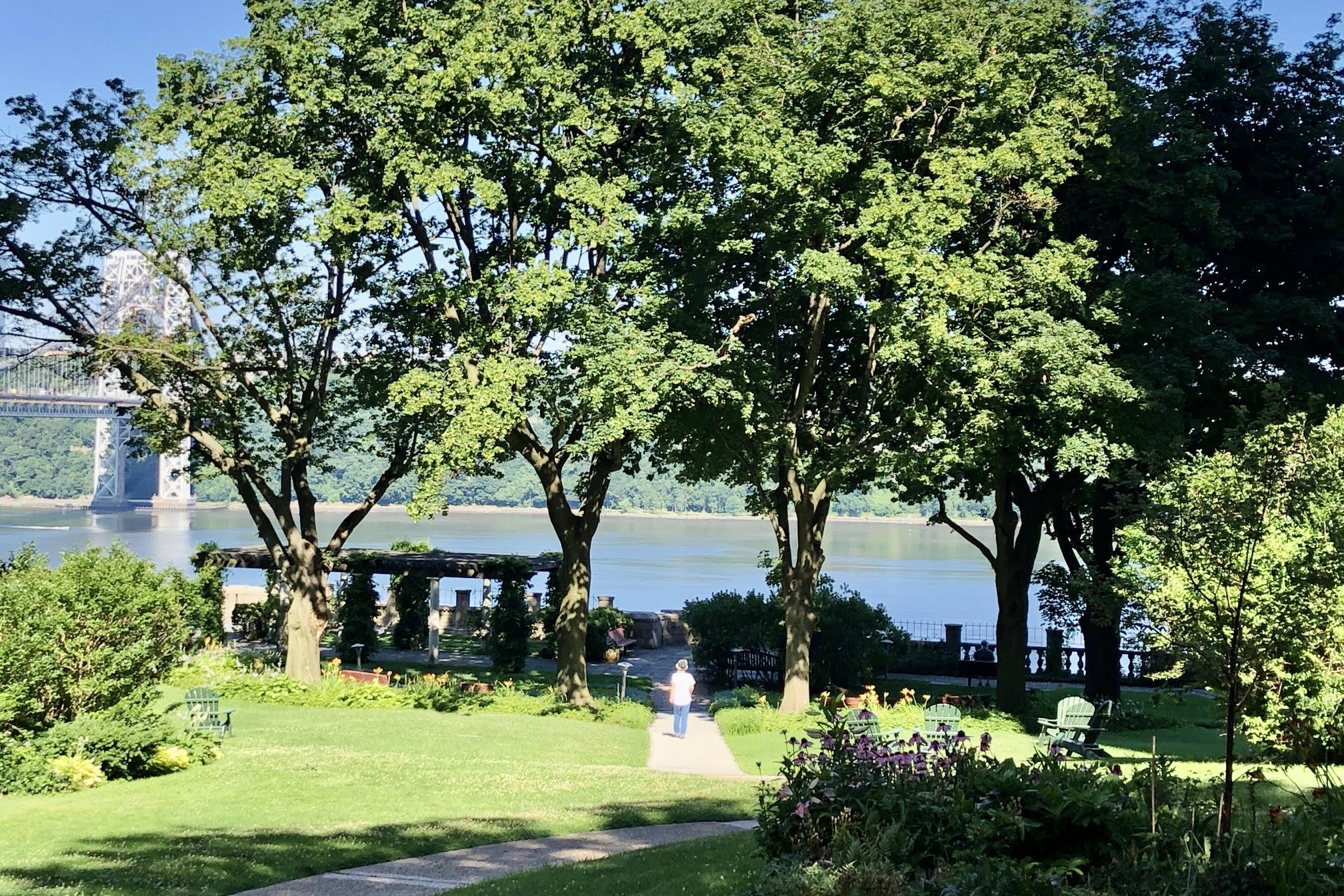 200 Cabrini Boulevard, Unit 10 Manhattan, NY 10033 - Photo 28 of 35 a front view of a house with a garden and trees