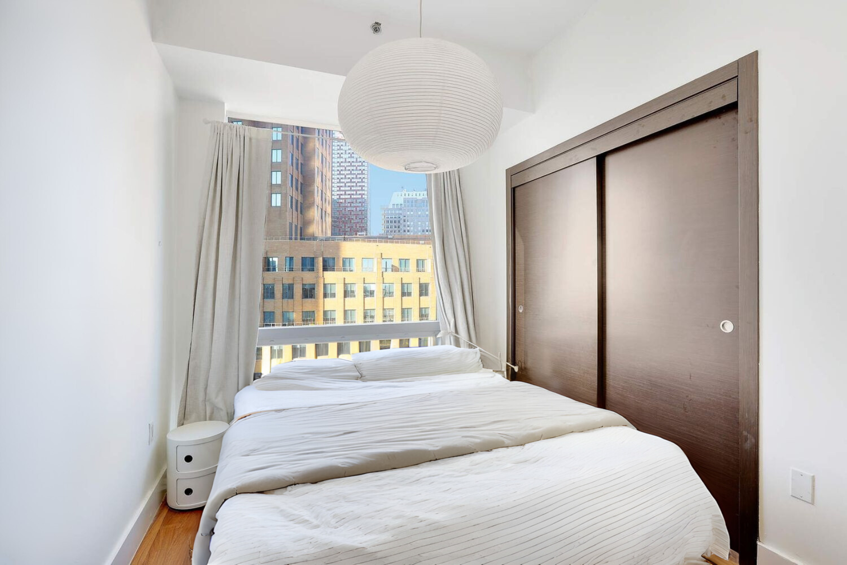 150 Myrtle Avenue, Unit 1105 Brooklyn, NY 11201 - Photo 5 of 24 a bedroom with a bed and a window