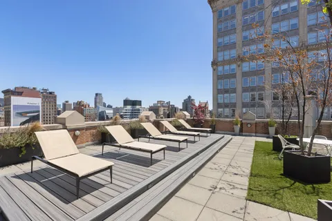 a view of a terrace with sitting area