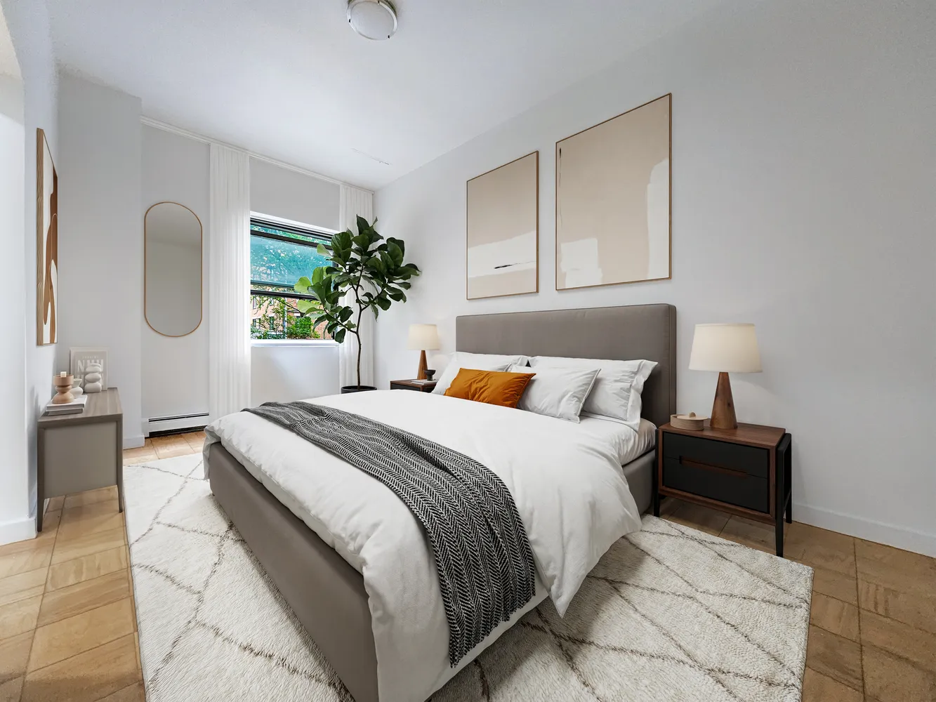 a bedroom with a bed lamp and a potted plant