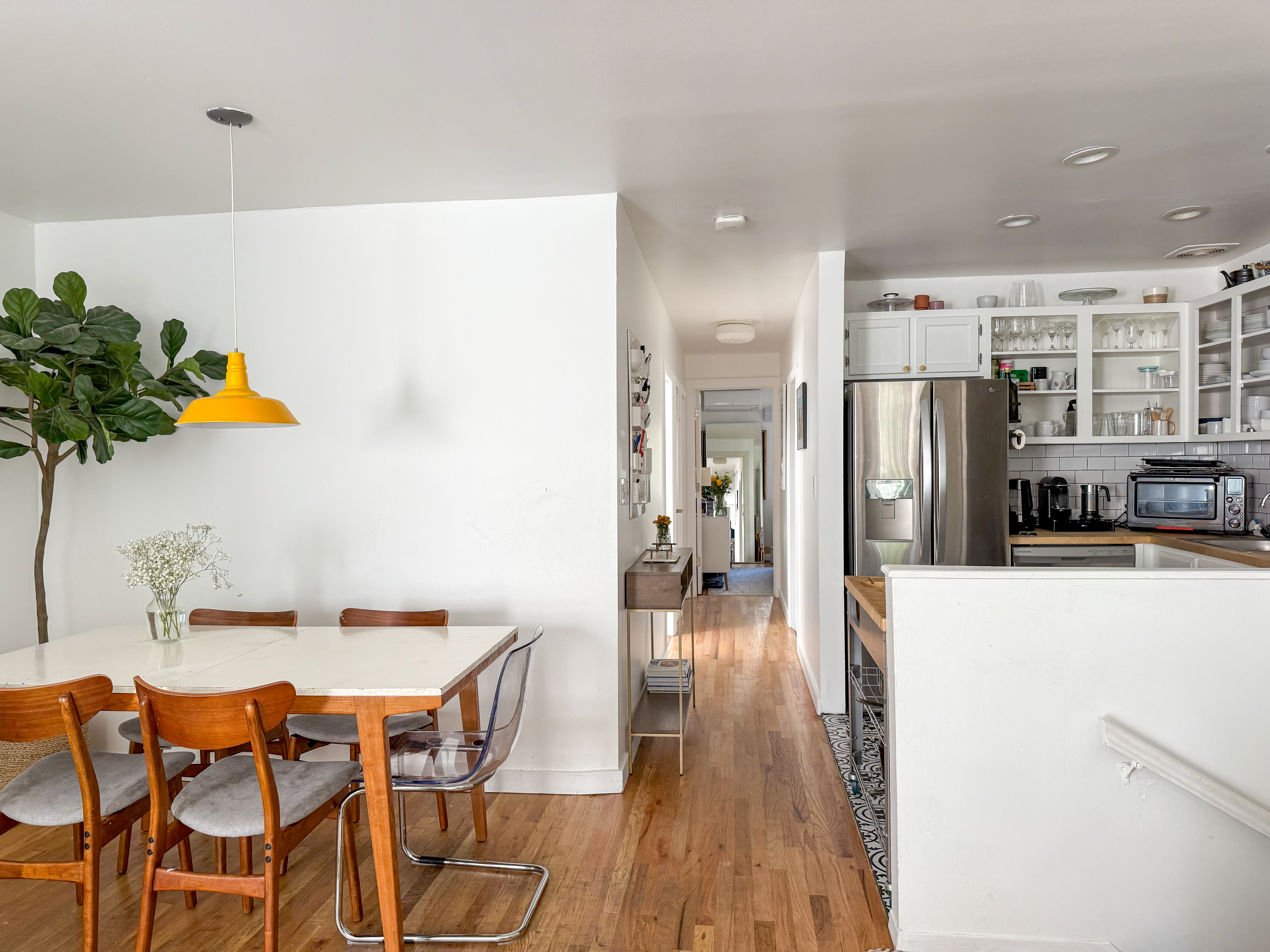 65 South 4th Street, Unit 2 Brooklyn, NY 11249 - Photo 3 of 12 a kitchen with stainless steel appliances a refrigerator and a table