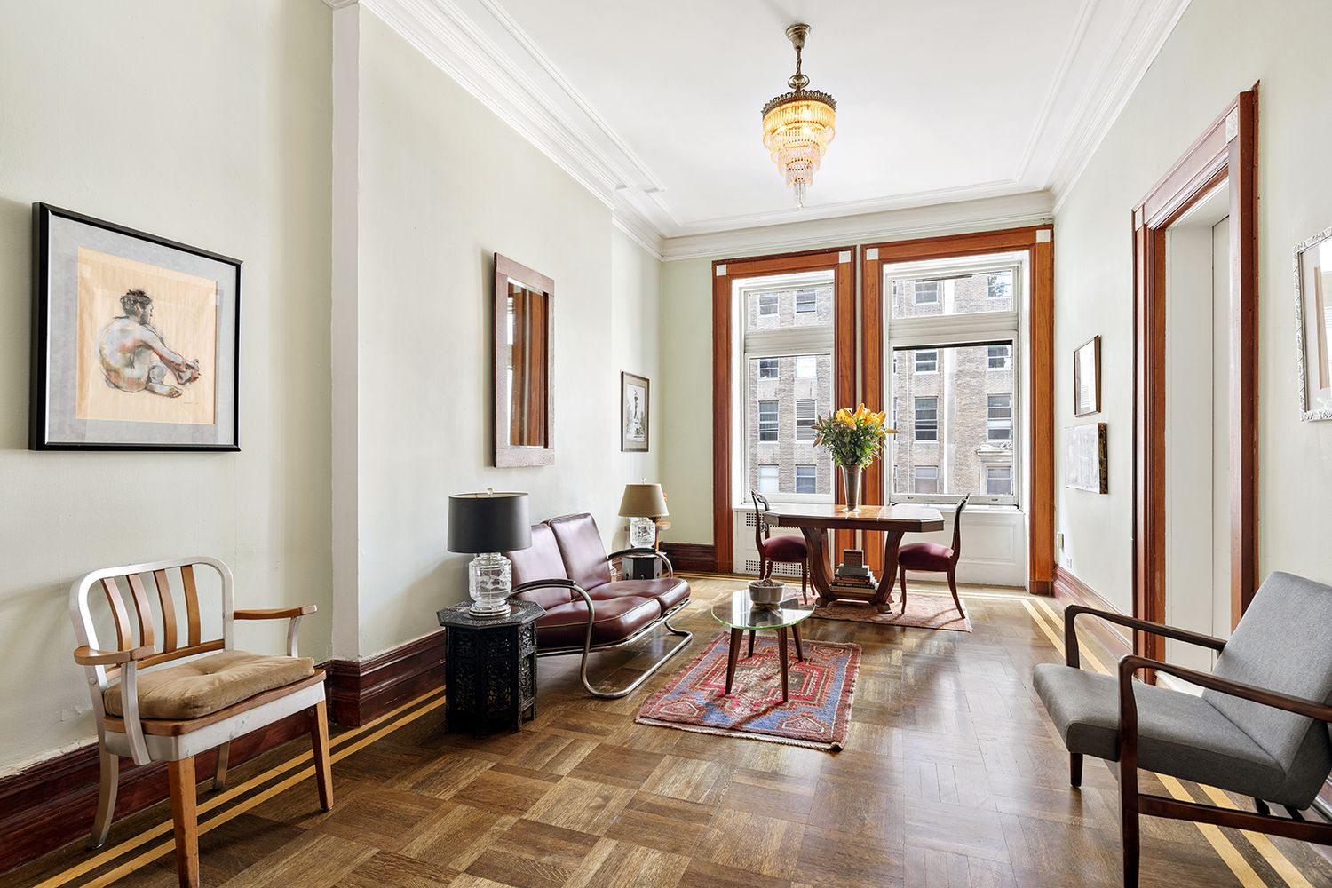 284 5th Avenue, Unit 5F Manhattan, NY 10001 - Photo 3 of 19 a living room with furniture and wooden floor
