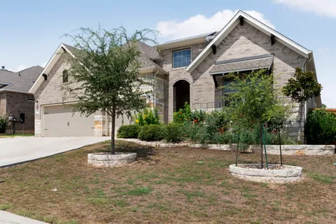 a view of a white house with a outdoor space