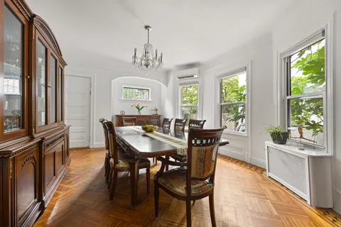 a view of a dining room with furniture window and outside view