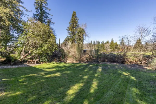 a backyard of a house with lots of green space