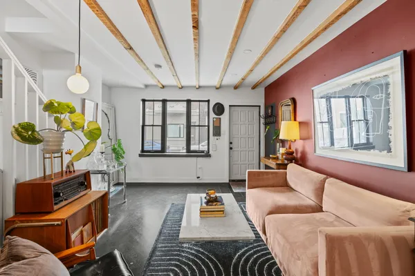 a living room with furniture and a window
