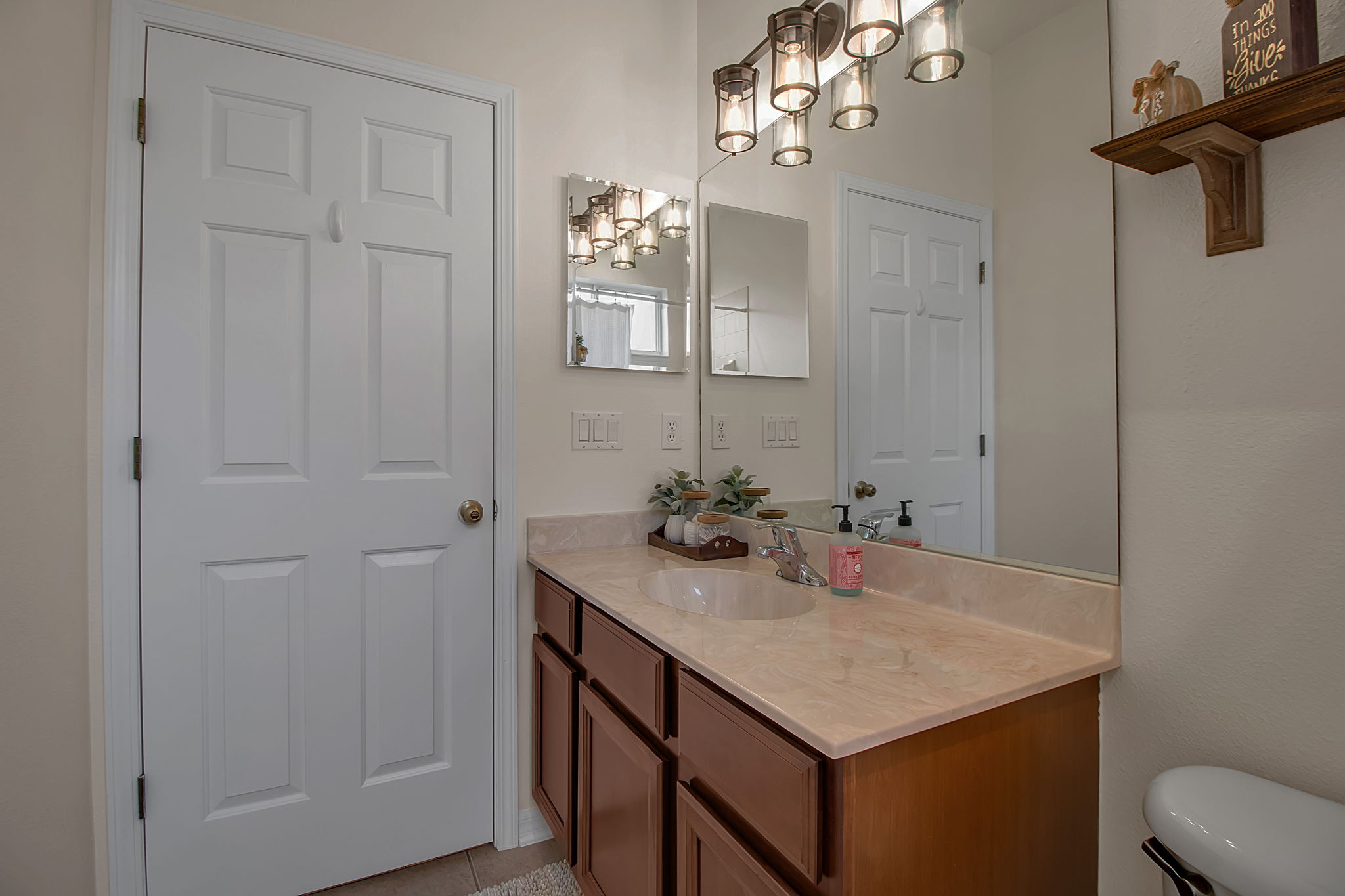 6106 34th Court East Bradenton, FL 34203 - Photo 46 of 69 a bathroom with a sink vanity and a mirror