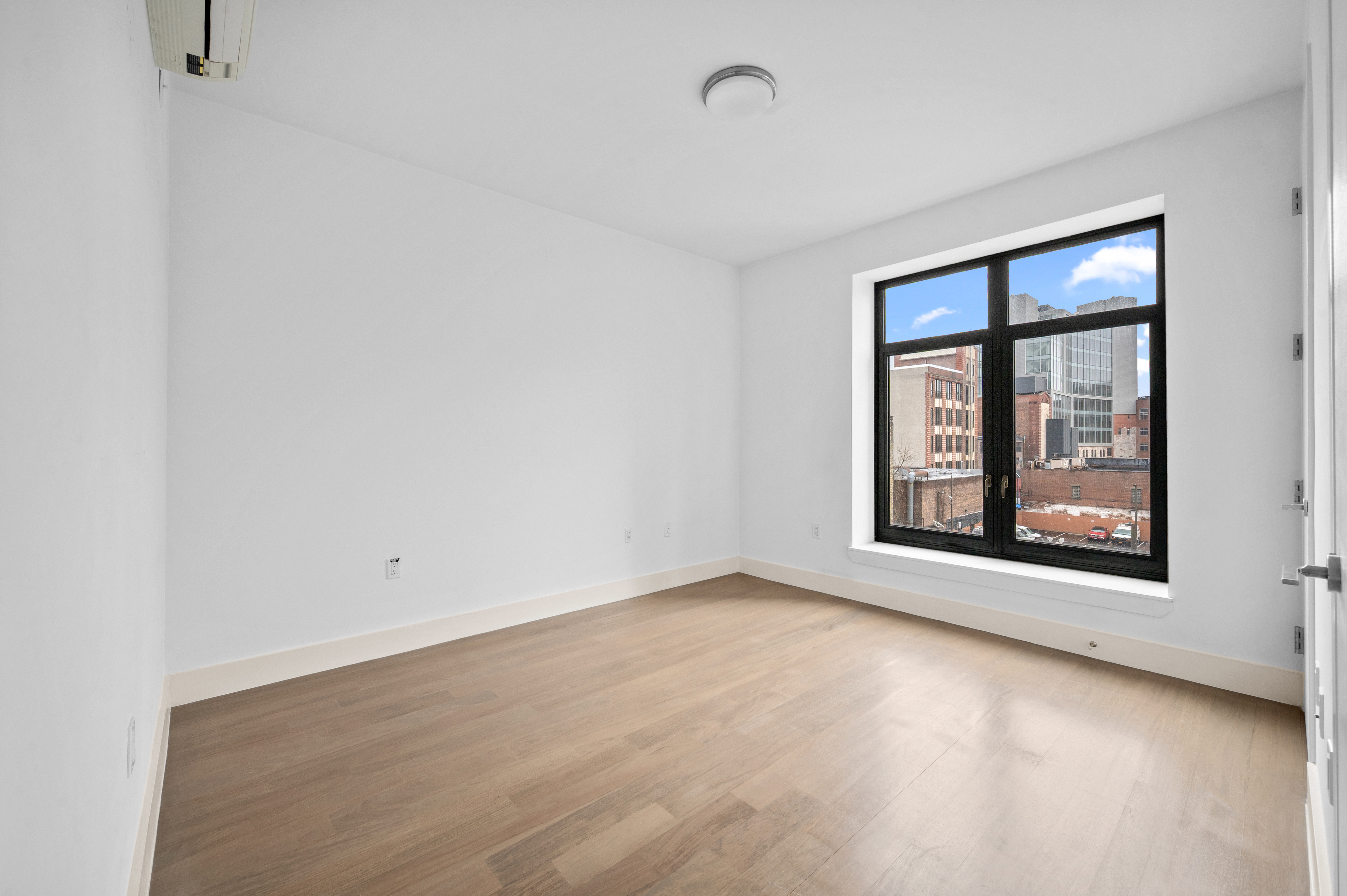 17 Convent Avenue Manhattan, NY 10027 - Photo 9 of 15 an empty room with a window