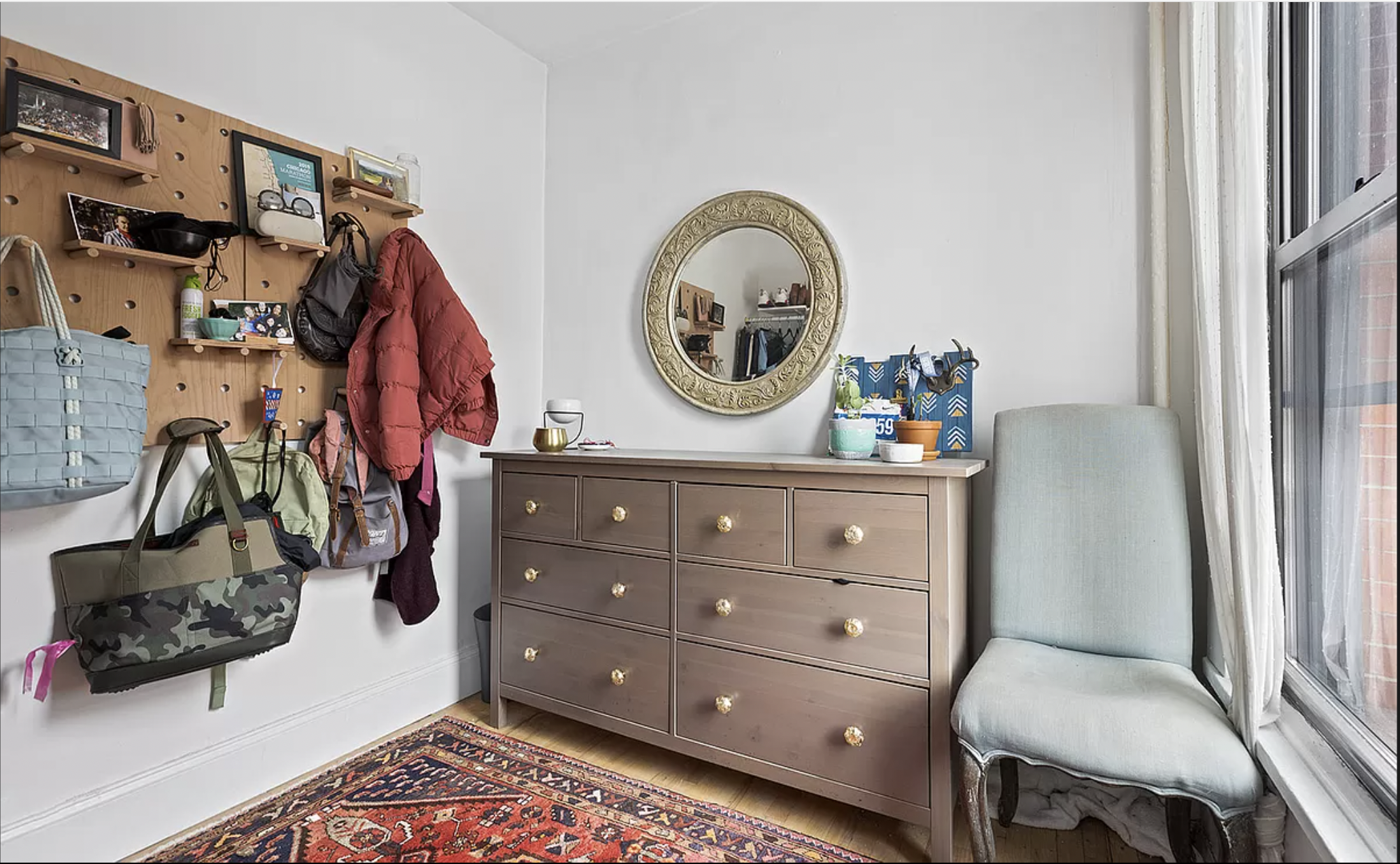 26 Fillmore Place, Unit 2 Brooklyn, NY 11211 - Photo 4 of 5 a living room with furniture and a mirror