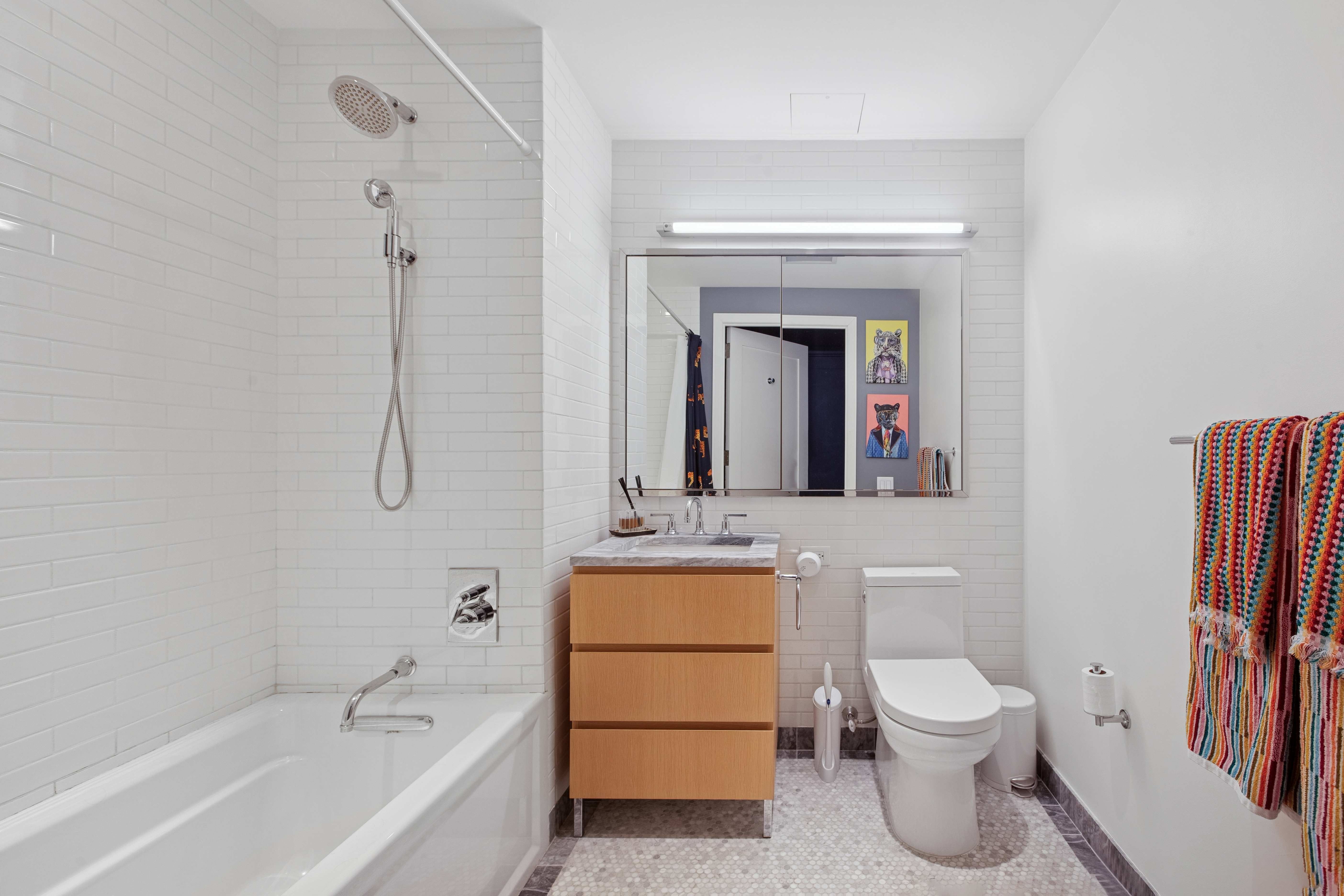 211 Schermerhorn Street, Unit 11A Brooklyn, NY 11201 - Photo 5 of 14 a bathroom with a toilet sink and mirror
