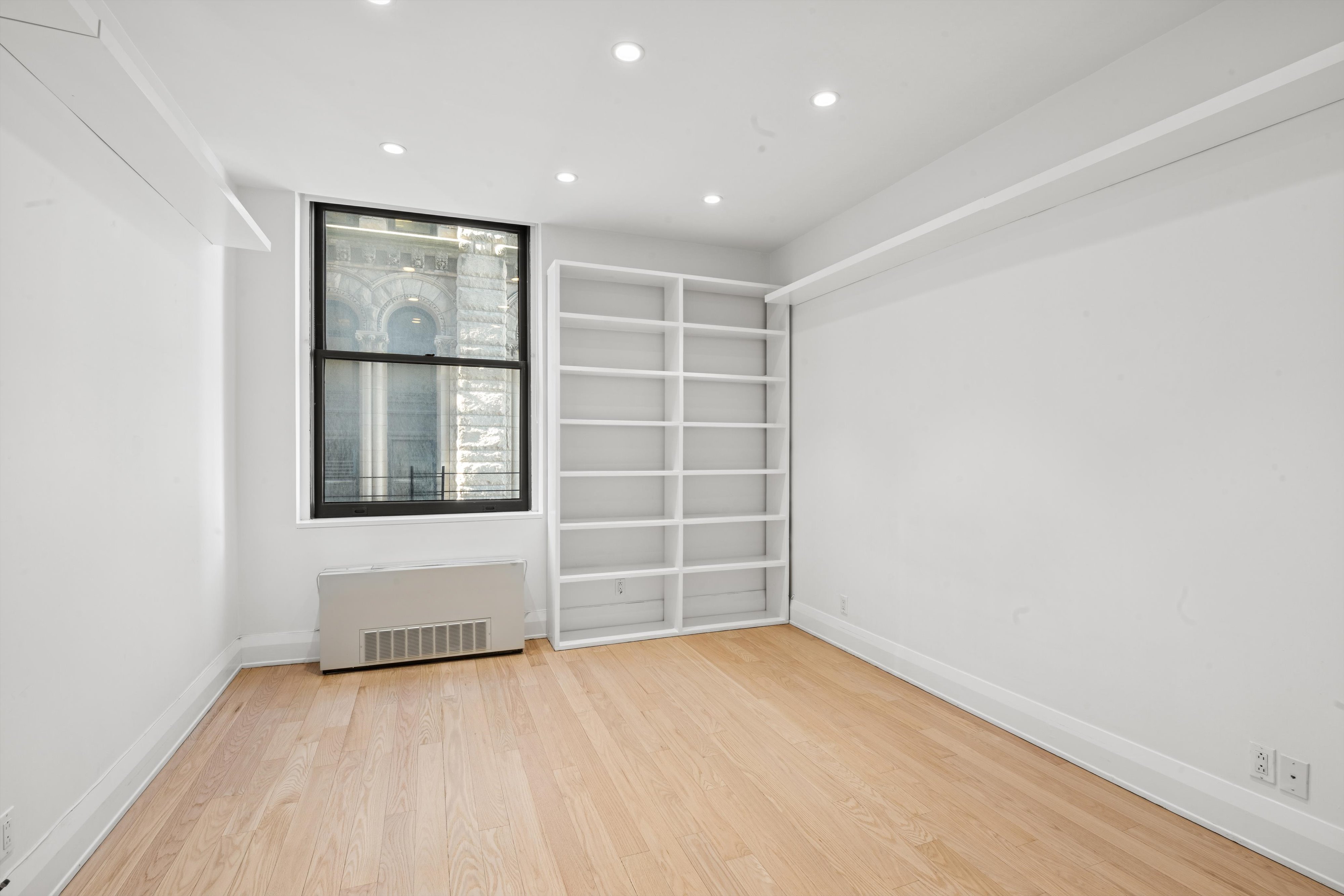 150 Nassau Street, Unit 11B Manhattan, NY 10038 - Photo 9 of 17 an empty room with a empty space and window