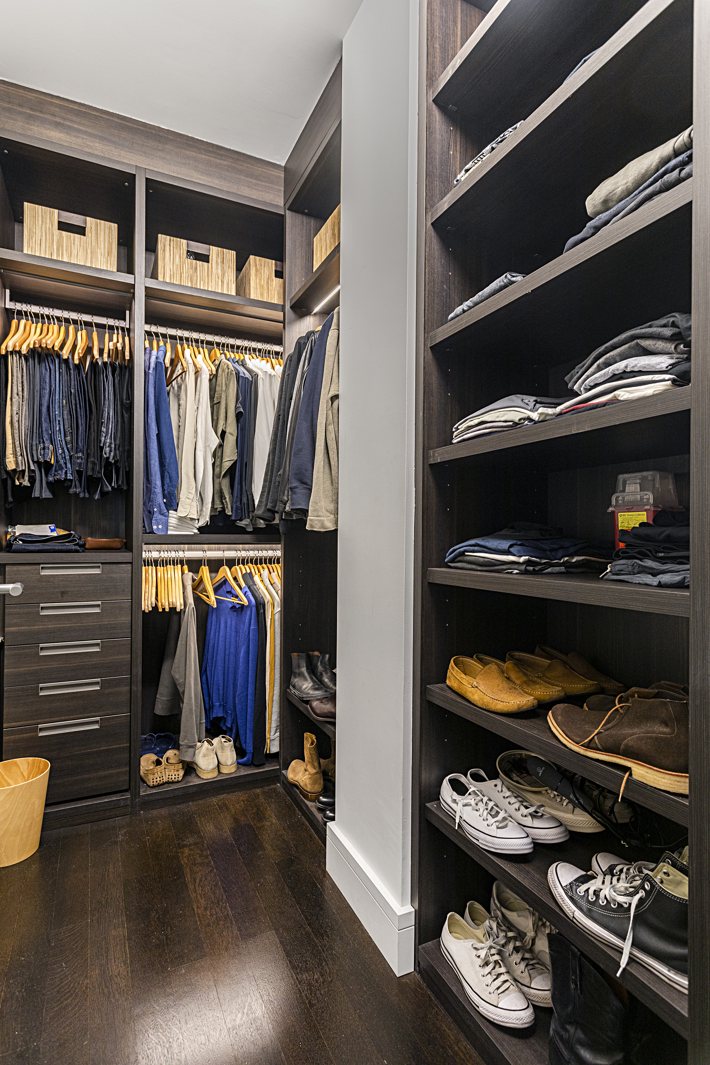 388 West Broadway, Unit 2 Manhattan, NY 10012 - Photo 23 of 27 a view of walk in closet with clothes and shoes
