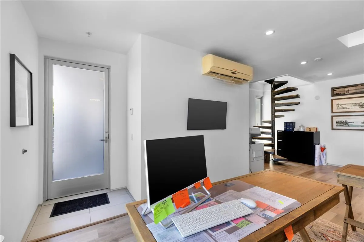 a room with furniture and a flat screen tv