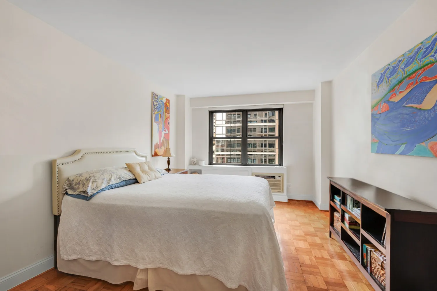 a bedroom with bed and a window