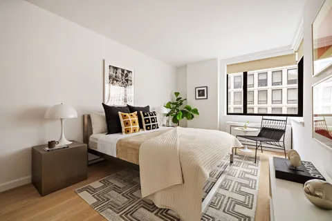 a bed room with a bed and a couch