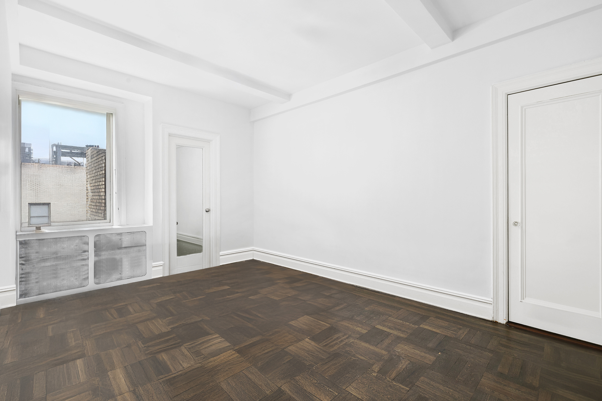 215 West 92nd Street, Unit 15A Manhattan, NY 10025 - Photo 12 of 14 an empty room with cabinet and mirrors