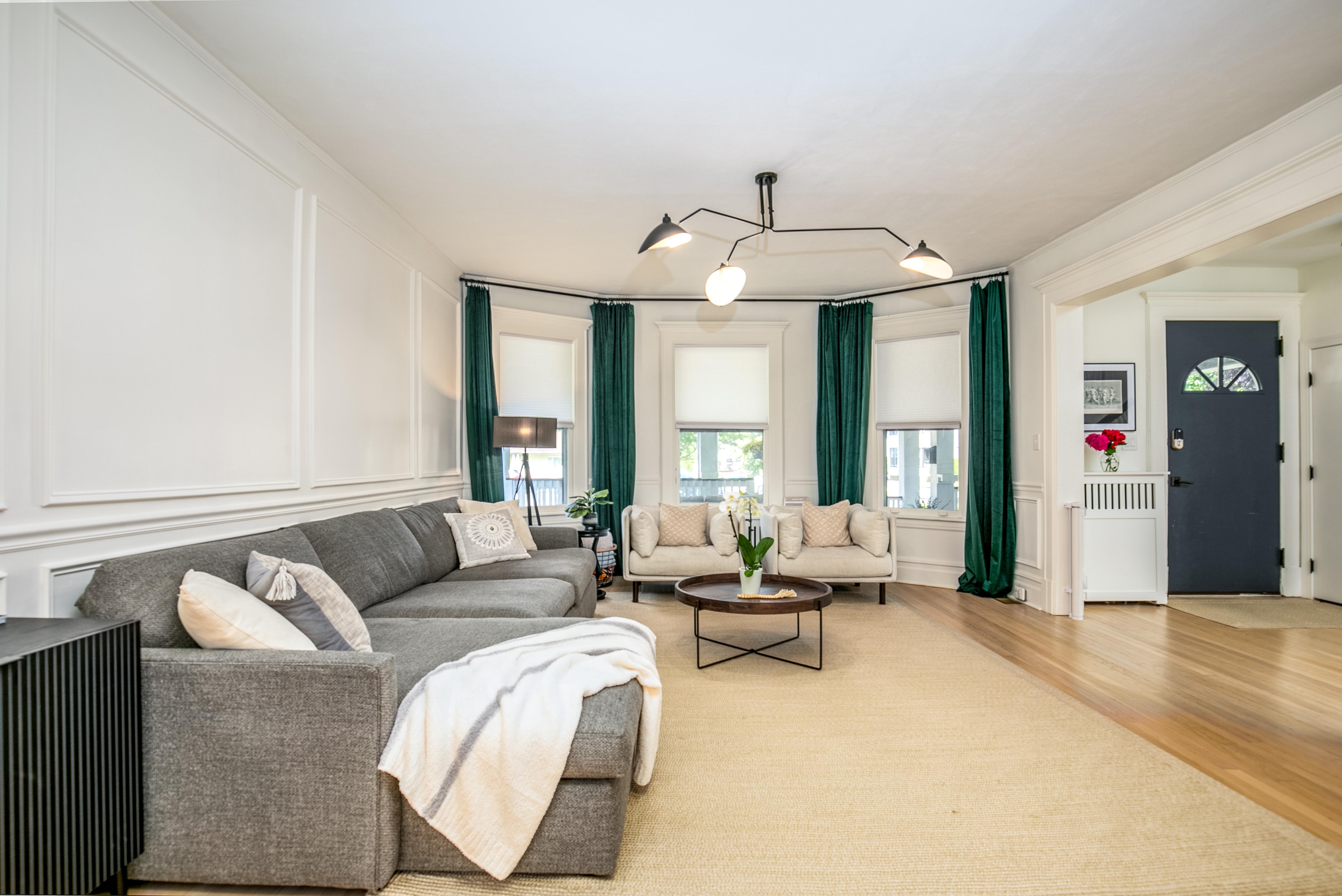 163 Ridge Road Rutherford, NJ 07070 - Photo 12 of 59 a living room with furniture and a chandelier
