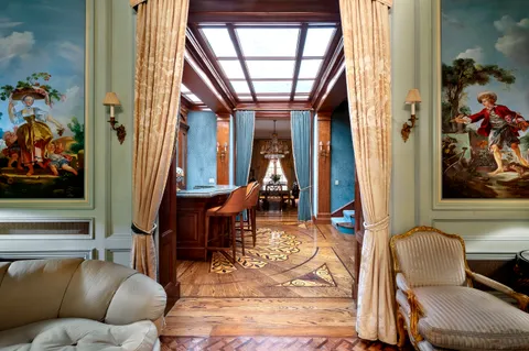 a living room filled with furniture and a table