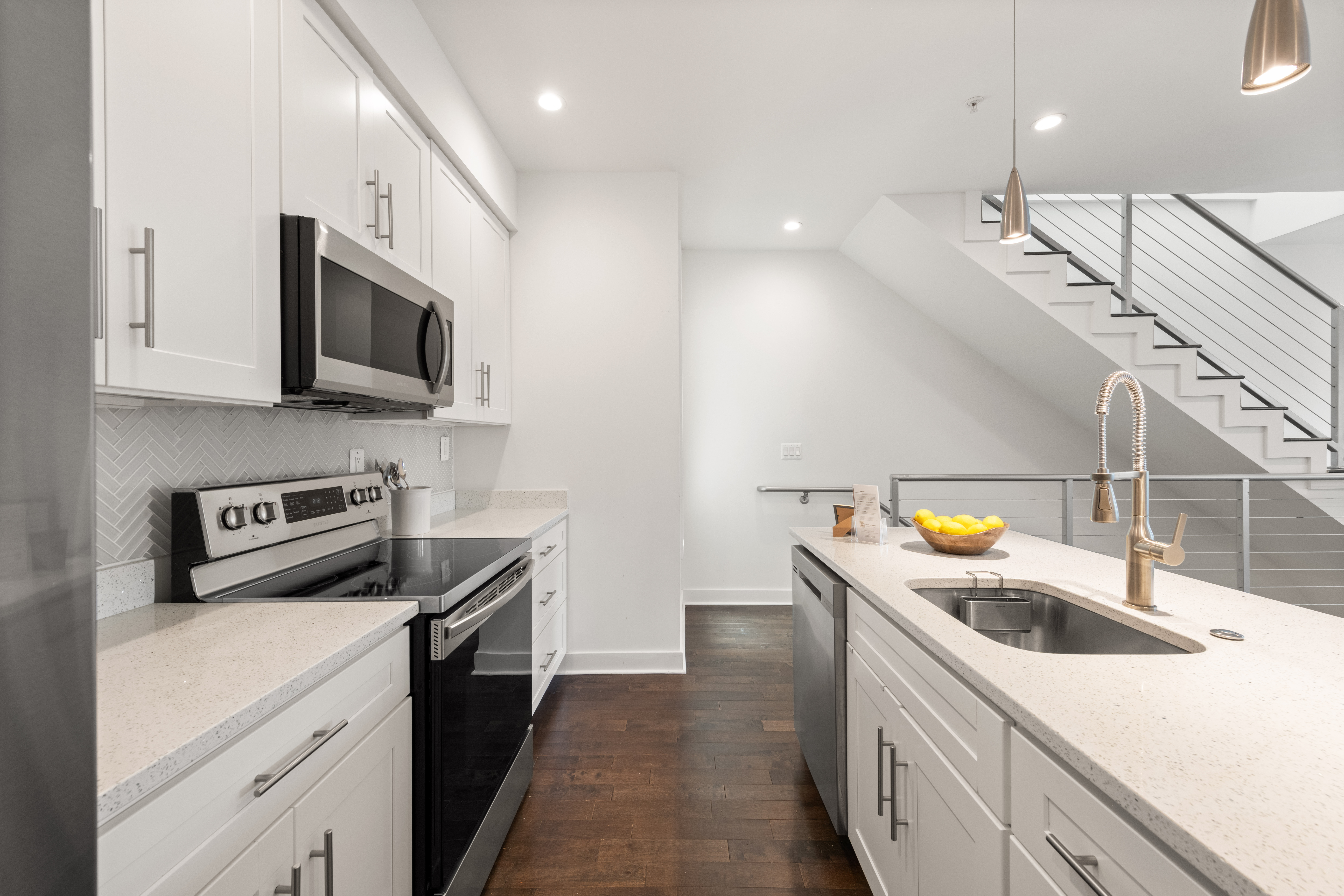319 Varnum Street Northwest, Unit 3 Washington, DC 20011 - Photo 7 of 29 a kitchen with stainless steel appliances a sink a stove top oven a counter space and cabinets