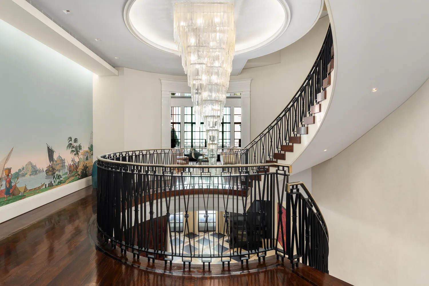 a view of staircase with furniture and wooden floor