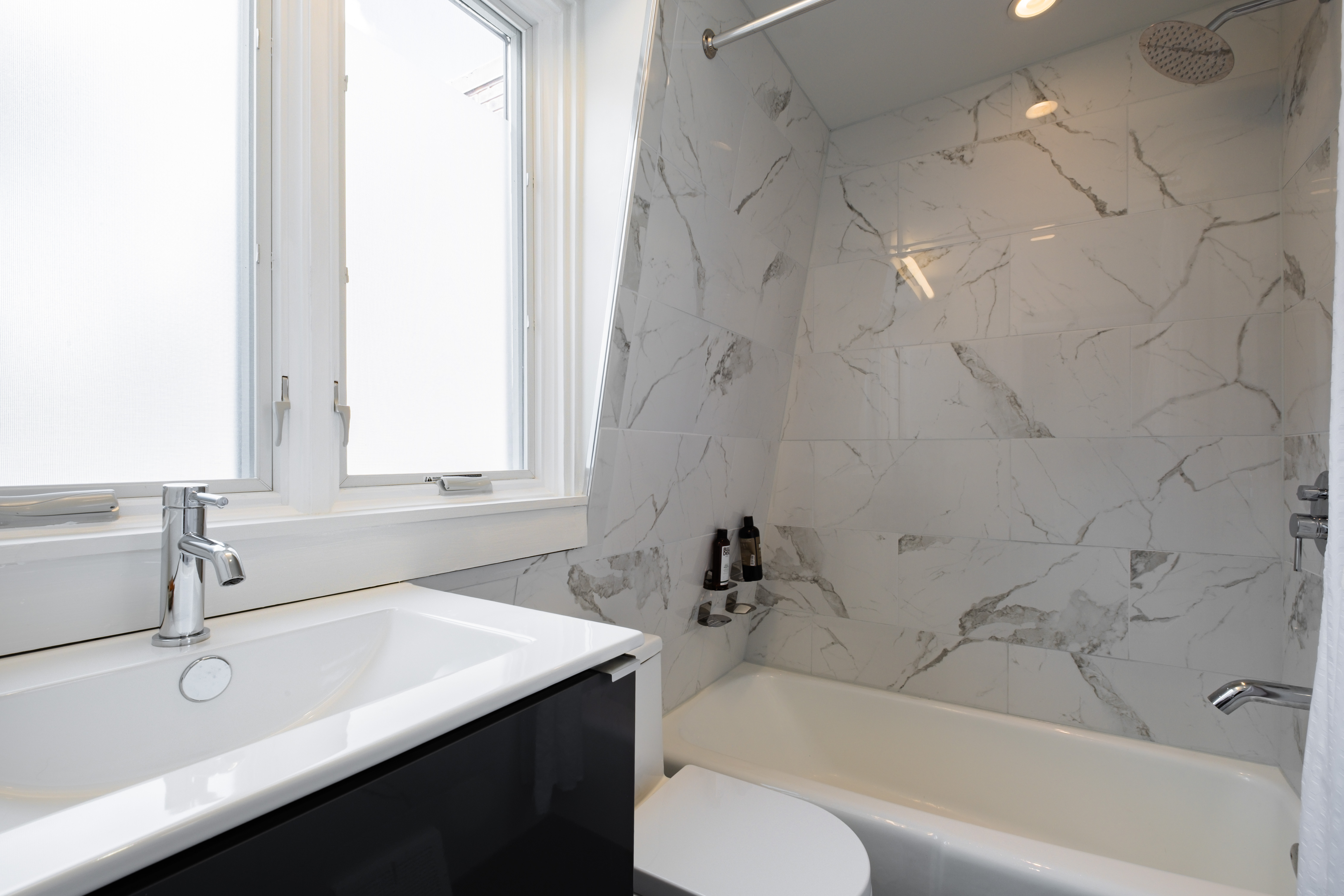 256 1/2 South 3rd Street Philadelphia, PA 19106 - Photo 44 of 73 a bathroom with a sink a toilet and bathtub