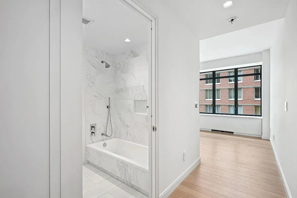 269 West 87th Street, Unit 9B Manhattan, NY 10024 - Photo 10 of 23 a bathroom with a bathtub and a shower