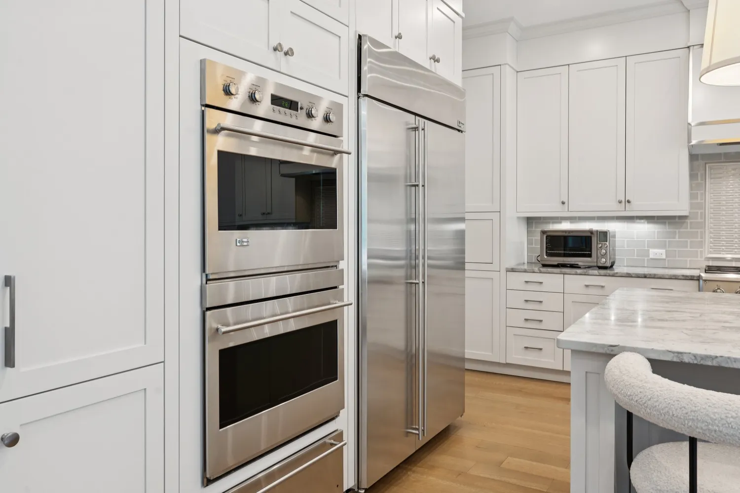 a dining room with furniture a rug and a window