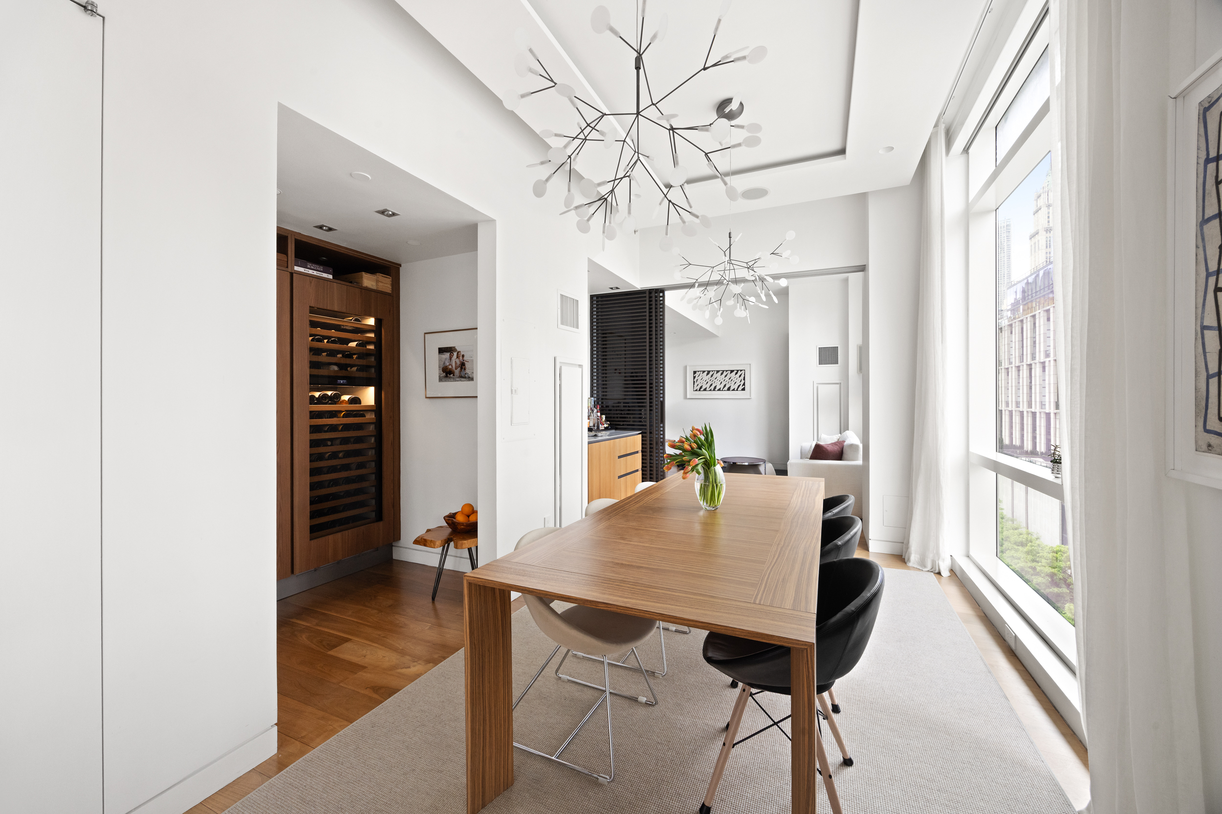 200 Chambers Street, Unit 7AI Manhattan, NY 10007 - Photo 5 of 28 a view of a dining room with furniture window and wooden floor
