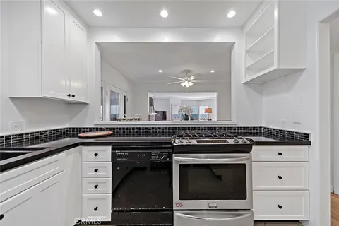 a kitchen with a stove and cabinets