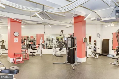 a view of a patio with couches table and chairs and potted plants