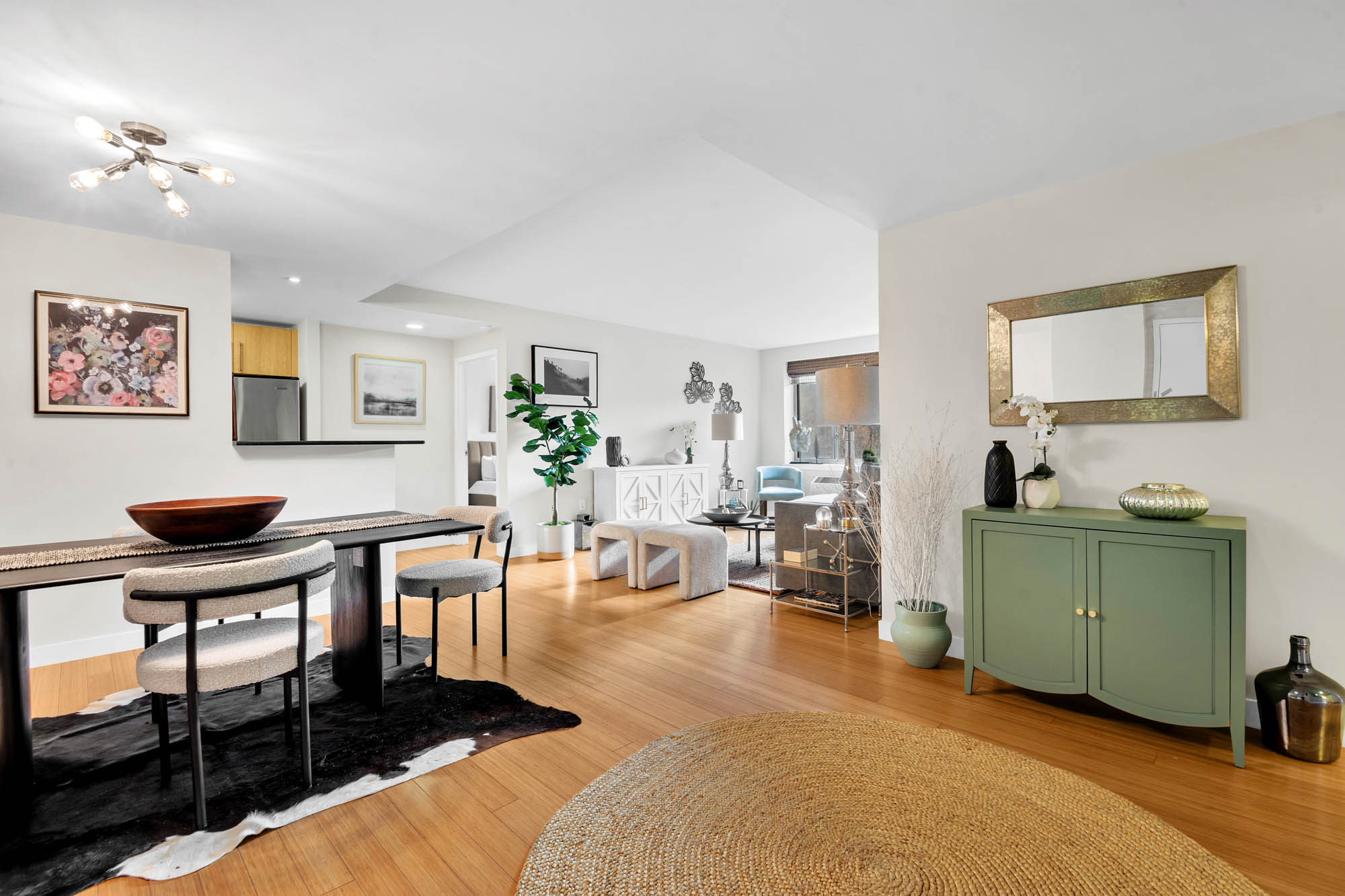 40 West 116th Street, Unit A313 Manhattan, NY 10026 - Photo 3 of 21 a living room with furniture and a painting on the wall